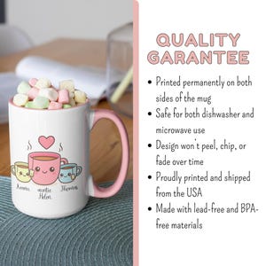 May include: White ceramic mug with a pink handle and rim, filled with marshmallows. The mug features a heart and three cartoon teacups with names below. Text on the right side reads "QUALITY GARANTEE".