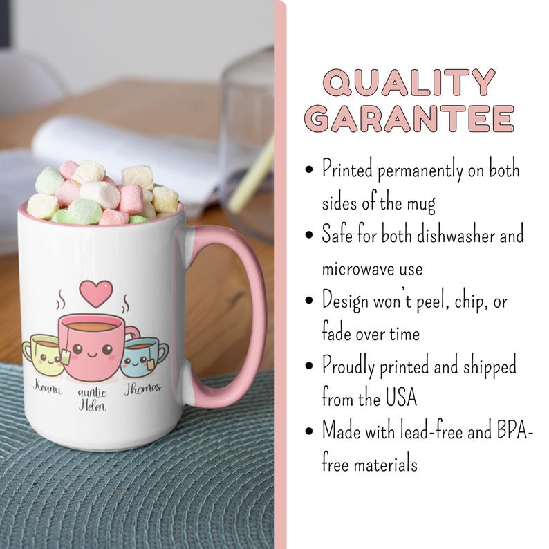 May include: White ceramic mug with a pink handle and rim, filled with marshmallows. The mug features a heart and three cartoon teacups with names below. Text on the right side reads "QUALITY GARANTEE".