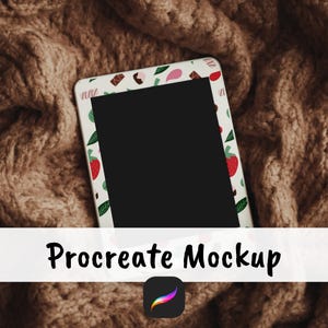 May include: A digital tablet with a black screen, framed by a white border adorned with a pattern of strawberries, leaves, and other small designs. The tablet rests on a textured, brown knitted surface. The text "Procreate Mockup" is displayed below the tablet.