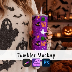 May include: A cylindrical purple tumbler featuring a repeating Halloween pattern of white ghosts, black witch hats, green cauldrons, orange lollipops, orange haunted houses, and the word Boo in black text, complete with a clear plastic straw.