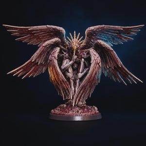 May include: A detailed figurine of a multi-winged creature with a central eye on its torso, holding a finger to its mouth in a shushing gesture. The figure features a golden spiked halo, textured wings with reddish-brown tones, and a base of skulls.