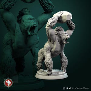 May include: A detailed, gray gorilla figurine, holding a large, cracked rock overhead. The gorilla has a fierce expression with its mouth open, and its fur is textured. The figurine is on a white base, with a second, shadowed gorilla in the background.