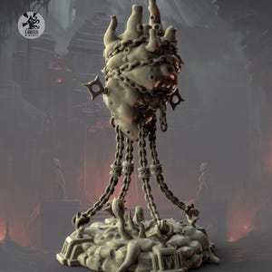 May include: A detailed sculpture of a hand bound by chains, with a textured surface and a base featuring intricate details. The sculpture has a dark, ominous aesthetic, with a logo in the upper left corner. The chains hang down to the base.