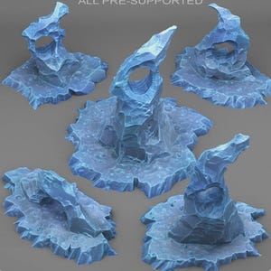 May include: A collection of five blue, stylized ice formations, each with a unique shape and texture. The formations have jagged edges and are set on a textured base. The text "ALL PRE-SUPPORTED" is visible at the top.