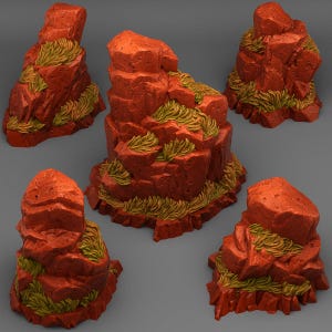 May include: Five miniature, red-orange rock formations with textured surfaces and patches of green-yellow grass. The rocks have a layered appearance, with varying heights and shapes, and are arranged against a neutral grey background.