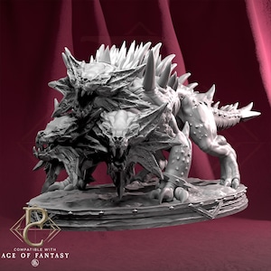 May include: A detailed, three-headed monster figurine with sharp teeth and spiky protrusions. The creature is grey and appears to be made of a hard material. The base of the figurine has the text "COMPATIBLE WITH AGE OF FANTASY".