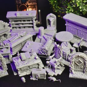 May include: A collection of gray miniature fantasy terrain pieces, including a table, chairs, a cabinet, a coffin, a desk, a chest, and an archway. The pieces are designed for tabletop gaming and role-playing games.