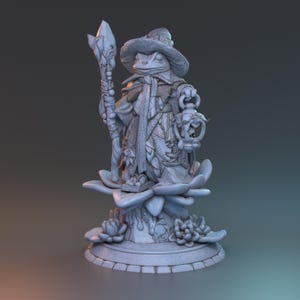 May include: A detailed, gray figurine of a frog wizard, wearing a hat and holding a staff and lantern. The frog is standing on a large flower base with intricate details. The figurine is a fantasy-themed collectible.