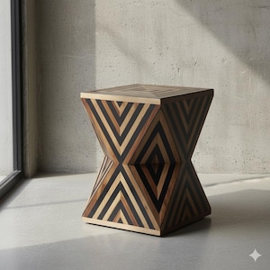 May include: Geometric wooden side table with a unique hourglass shape. The table features a repeating chevron pattern in shades of brown, black, and natural wood. The top and base are square, while the center narrows.