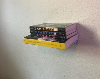 Libreria galleggiante stampata in 3D: espositore invisibile per libri