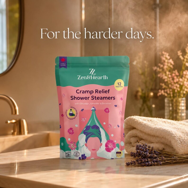 Cramp relief pouch on warm bathroom counter with lavender bundle and folded cream towel evening light