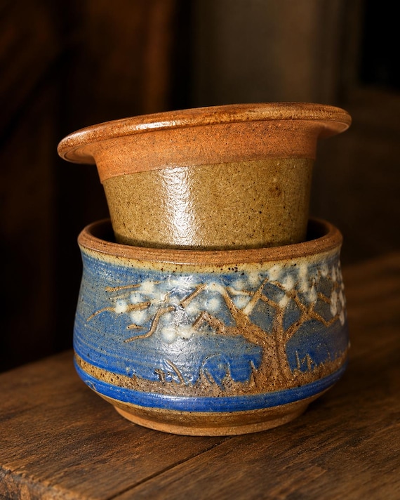 A wheel-thrown stoneware French butter keeper that keeps butter soft at room temp without refrigeration — genuinely functional artisan pottery most people have never encountered.