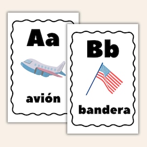 May include: Two white educational flashcards with black scalloped borders. The first card displays the letters Aa, a light blue airplane illustration, and the word avión. The second card displays the letters Bb, a United States flag, and the word bandera.
