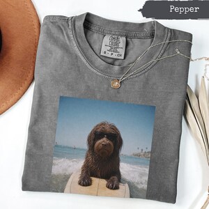 Comfort Colors® Cool Surfing Dog With Sunglasses Shirt, Funny Beach Surfboard Tee, Ocean Vacation Pet Lover Gift, Goldendoodle Mom T-Shirt.