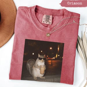 Crimson Comfort Colors t-shirt with a squirrel wearing sunglasses drinking coffee.