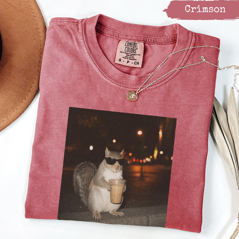 Crimson Comfort Colors t-shirt with a squirrel wearing sunglasses drinking coffee.