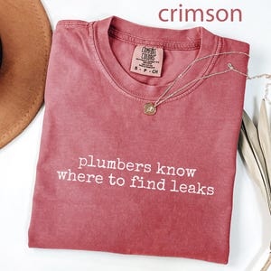 Plumbers know where to find leaks, crimson funny t-shirt, witty plumber shirt, plumber gift, humorous plumbing tee, men's novelty shirt