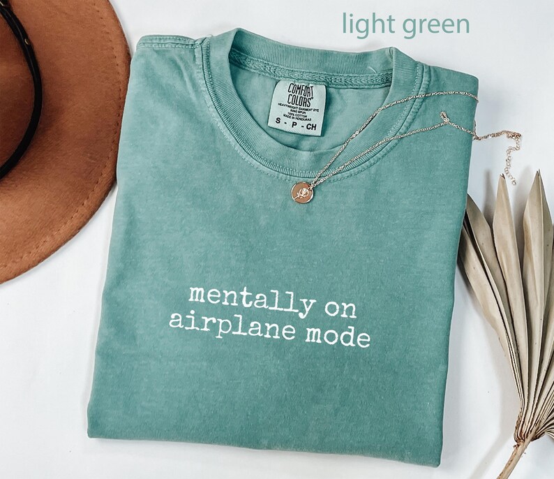 Mentally on airplane mode tshirt, light green graphic tee, casual outfit, travel themed t-shirt, fun summer top, unisex shirt