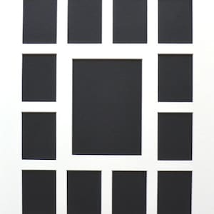 May include: A white picture frame with 12 black rectangular openings for photos. The openings are arranged in a grid pattern.