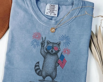 Feral and Free Raccoon Shirt, Funny 4th of July Tee, Patriotic Animal Graphic, Comfort Colors Shirt, Gift for Her, USA Fireworks Tee