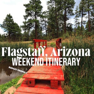 May include: A bright red wooden footbridge spans a small pond surrounded by tall green reeds and pine trees. The text "Flagstaff, Arizona WEEKEND ITINERARY" and "BUDGET FRIENDLY" is overlaid in white on the image of the outdoor landscape.