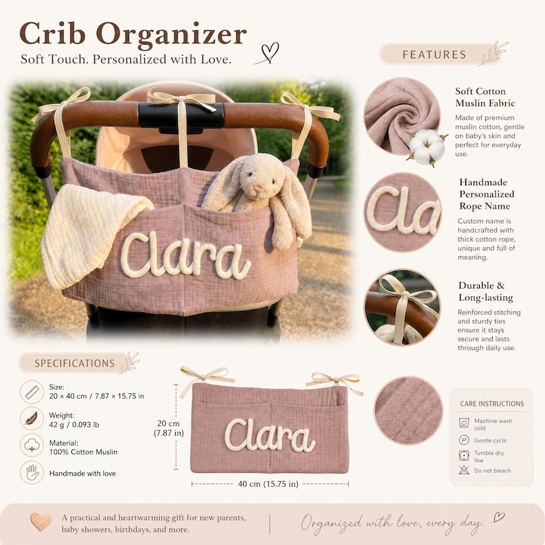 May include: A dusty rose cotton muslin crib organizer featuring the name Clara in thick white rope lettering. The rectangular organizer has two pockets, cream-colored ribbon ties, and measures 7.87 inches by 15.75 inches, weighing 0.093 pounds.