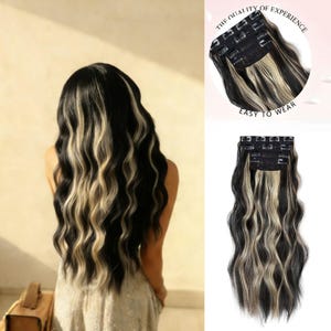 May include: Black and blonde wavy hair extensions with clips. The extensions are shown on a person and separately. The text "THE QUALITY OF EXPERIENCE" and "EASY TO WEAR" are visible in the image.