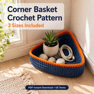 May include: A blue crochet corner basket with an orange trim, containing a small potted plant, decorative stones, and a white cable. The text "Corner Basket Crochet Pattern" and "3 Sizes Included" are displayed at the top.