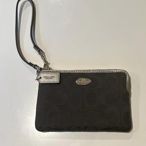 1990s Coach black wristlet with zipper closure