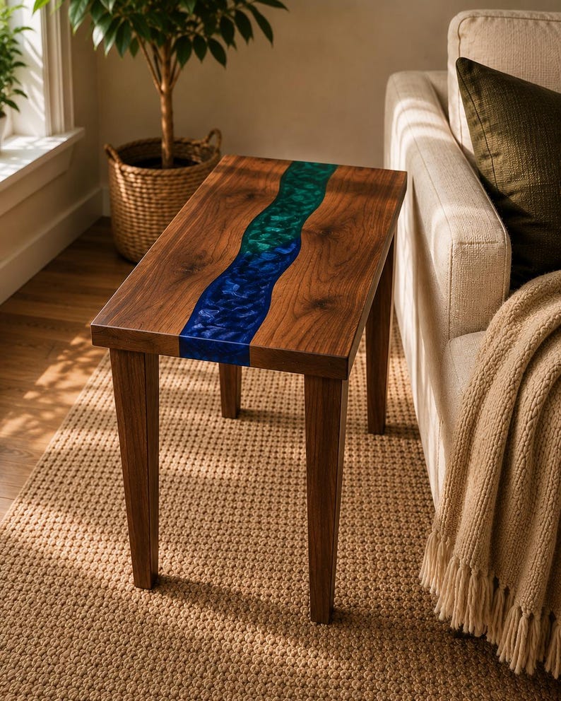 May include: A rectangular side table constructed from dark brown wood featuring a central, wavy inlay of translucent resin that transitions from a vibrant emerald green at the top to a deep royal blue at the bottom, supported by four straight legs.