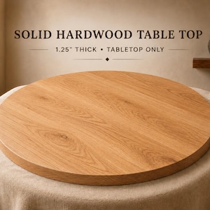 May include: A round solid hardwood table top with a natural light brown wood grain finish. The text on the image reads: SOLID HARDWOOD TABLE TOP, 1.25" THICK • TABLETOP ONLY. This circular wooden surface features visible wood knots and grain patterns.