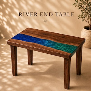 May include: A rectangular end table featuring a dark brown wood grain surface with a central river-like inlay of blue and green resin. The table stands on four straight wooden legs. The text RIVER END TABLE is printed above the furniture piece.