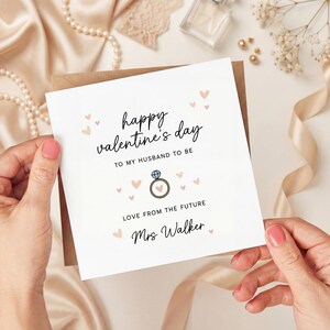 May include: A Valentine's Day card with the message "Happy Valentine's Day" and "To My Husband To Be." The card features a ring illustration and the words "Love From The Future Mrs. Walker."