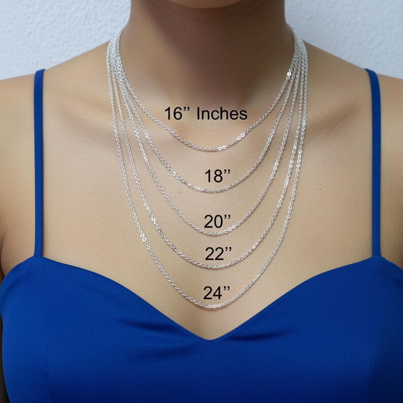 May include: Silver chain necklaces of varying lengths, displayed on a person. The lengths are labeled: 16 inches, 18 inches, 20 inches, 22 inches, and 24 inches. The person is wearing a blue top.