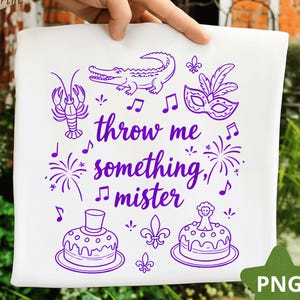 May include: White square fabric with a purple design featuring a crawfish, alligator, mask, musical notes, fireworks, cakes, and the text "throw me something, mister."