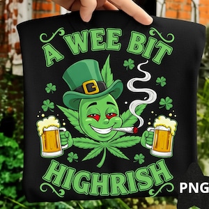 May include: Black t-shirt with a green cartoon cannabis leaf character wearing a green hat and smoking a cigarette. The text "A Wee Bit Highrish" is in green. Two mugs of beer and shamrocks are also featured.