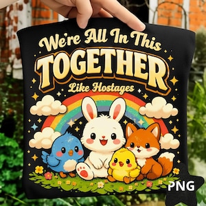 May include: Black pillow with the text "We're All In This Together Like Hostages." The pillow features a cartoon rainbow, clouds, and cute animal characters including a bunny, fox, bird, and chick.