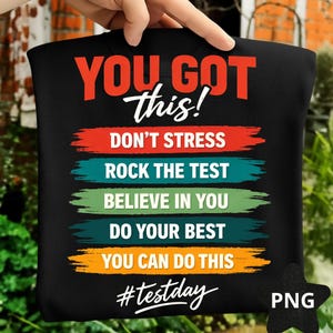 May include: Black t-shirt with motivational text in red, white, blue, green, and yellow. The text reads "YOU GOT this!" and includes phrases like "DON'T STRESS" and "ROCK THE TEST." The hashtag "#testday" is also present.