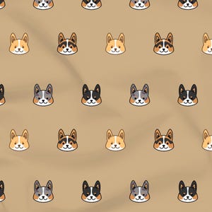 May include: Tan fabric with a repeating pattern of cartoon corgi faces. The corgi faces are in various colors, including tan, black, white, and gray. The fabric has a slight texture and folds.