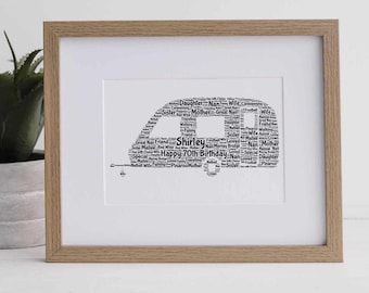 May include: A framed print with a campervan design made of words. The words form the shape of the van and include "Shirley" and "Happy 70th Birthday." The frame is light brown wood, with a white mount.