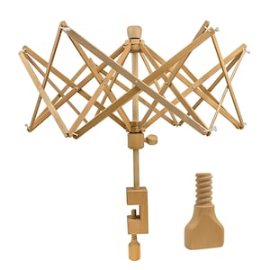 May include: A wooden yarn swift, designed to hold yarn for winding into balls. The swift has an umbrella-like design with multiple wooden arms that expand and contract. A wooden clamp and screw are included for securing the swift to a table.