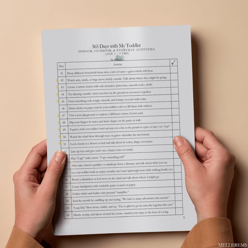 May include: A printed activity sheet titled 365 Days with My Toddler, Indoor, Outdoor, & Everyday Activities (Age 1-3 Yrs). The document features a table with columns for Day, Activity, and a checkmark, listing tasks from day 41 to 60.