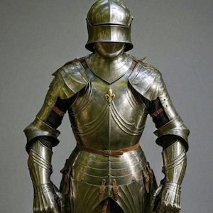 May include: Full suit of medieval armor in polished steel. The armor includes a helmet, chest plate, arm and leg protection, and gauntlets. A decorative gold fleur-de-lis is centered on the chest. The armor is secured with leather straps and buckles.