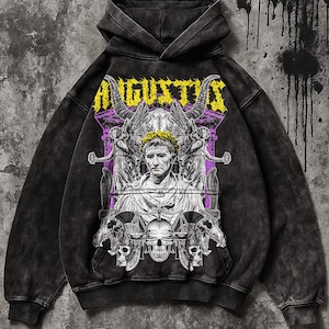May include: Black hooded sweatshirt with a graphic design featuring the word "AUGUSTUS" in yellow, a portrait, and skull imagery. The design is printed on the front. The sweatshirt has a distressed, vintage look.