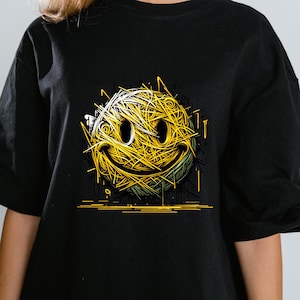 May include: Black t-shirt with a yellow smiley face graphic. The smiley face is made up of yellow lines, giving it a textured look. The design is set against a black background, creating a strong contrast.