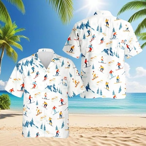 May include: White button-down shirt with a repeating pattern of skiers, trees, and mountains. The skiers are depicted in various colors, including red, yellow, and blue. The shirt has short sleeves and a classic collar.