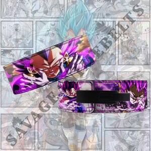 May include: Two weightlifting wrist wraps with a striking design of a character with purple hair and a determined expression. The wraps are mainly purple with black detailing and a black strap.