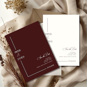 May include: Burgundy and white wedding invitation suite. The burgundy card features the names "Piper & James" and "Save the Date" with the date and location. The white card has the same text. Includes an envelope.