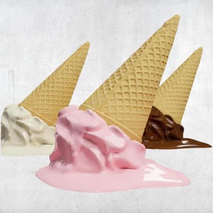May include: Three ice cream cones with melted ice cream. One has vanilla ice cream, one has pink ice cream, and one has chocolate ice cream. The cones are made of a waffle material.