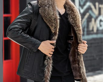 May include: Black leather jacket with a brown fur collar and lining. The jacket has a button closure and a classic design. The fur collar adds a touch of luxury and warmth to the outerwear.